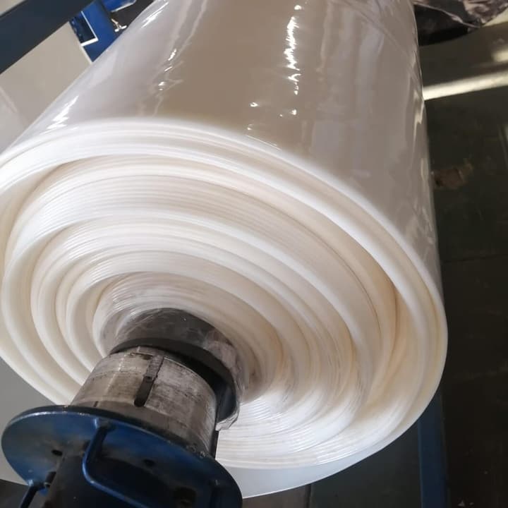 Roll of 200 micron greenhouse plastic on a factory spindle